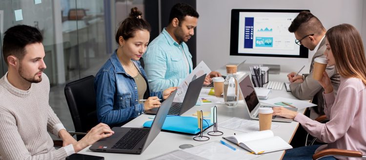 people with computers describing website performance competitive advantage businesses